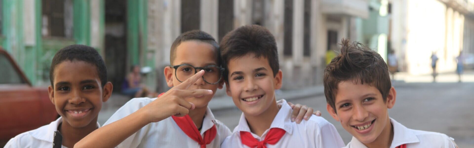 Havana, Cuba-February 8, 2013-School boys  mug for the camera while holding their school books.